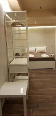 Letto o letti in una camera di LA SUITE AL CENTRO CITTÀ