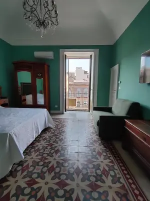 Letto o letti in una camera di Finestre in piazza