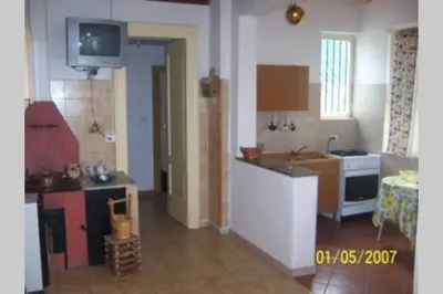 Cucina o angolo cottura di CASA DELLE PALME GIARRE SICILIA A 3 KM DAL MARE