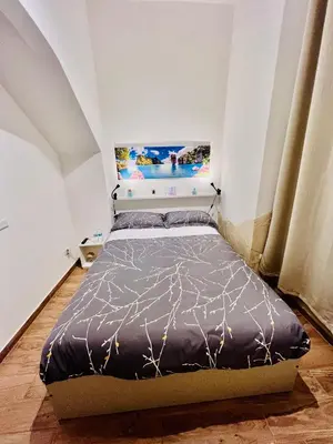 Letto o letti in una camera di Il Mondo
