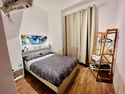 Letto o letti in una camera di Il Mondo