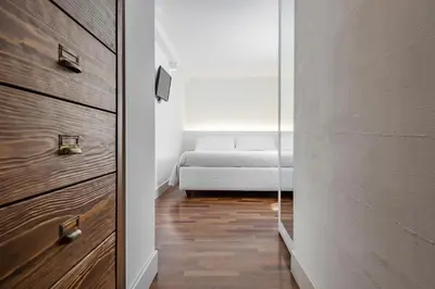 Letto o letti in una camera di Ferrini Home - Via Monte Sant'Agata
