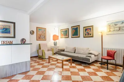 Area soggiorno di GuestHost - Via Etnea Cozy Apartment with Balcony