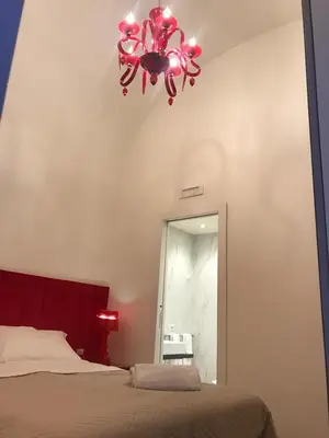 Letto o letti in una camera di Motta Palace Apartments & Rooms