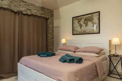 Letto o letti in una camera di Villa Romano