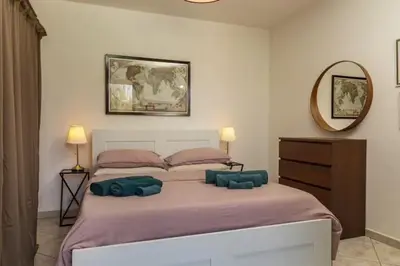 Letto o letti in una camera di Villa Romano