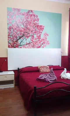 Letto o letti in una camera di Villa Morgante B&B