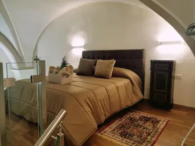 Letto o letti in una camera di Dimora del Monsignore