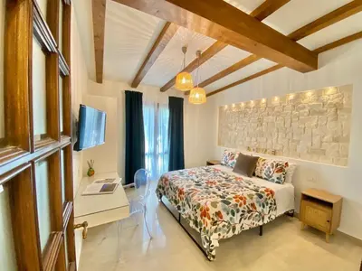 Letto o letti in una camera di Casa vacanza Il Mandarino