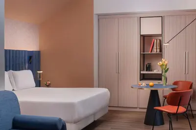 Letto o letti in una camera di NH Catania Centro