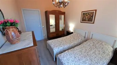 Letto o letti in una camera di Villa Etna