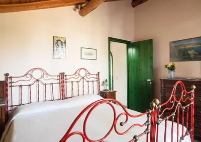 Letto o letti in una camera di B&B La Casa del Ficus