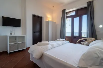 Letto o letti in una camera di Casa Scala