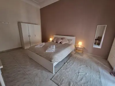 Letto o letti in una camera di Etna Ocean Rooms