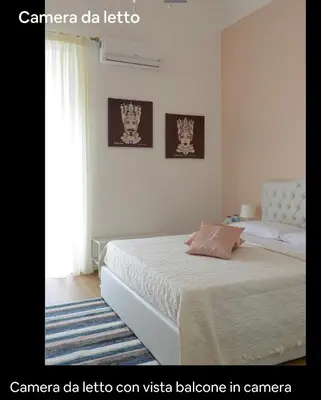 Letto o letti in una camera di Filomena Graceful