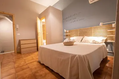 Letto o letti in una camera di L'angoletto del viaggiatore