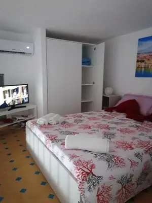 Letto o letti in una camera di Perla Azzurra
