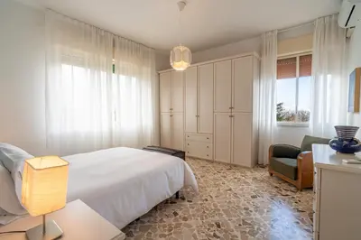Letto o letti in una camera di Villa Alberto