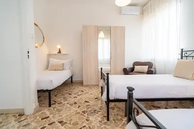Letto o letti in una camera di Villa Alberto