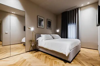 Letto o letti in una camera di Ferrini Home - Etnea Heritage