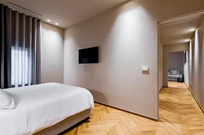 Letto o letti in una camera di Ferrini Home - Etnea Heritage