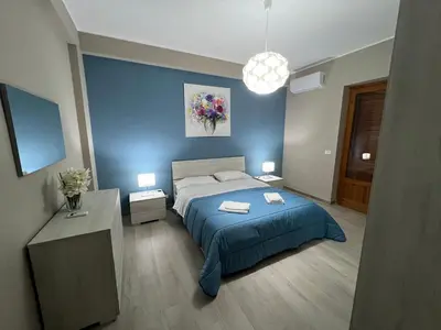 Letto o letti in una camera di Casa vacanza Tropicana Home