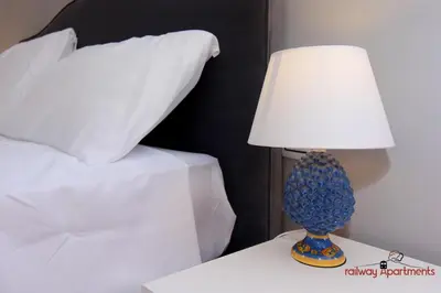 Letto o letti in una camera di Railway Apartments