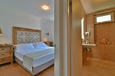 Letto o letti in una camera di San Anton Hotel