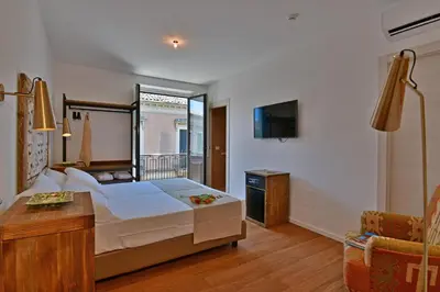 Letto o letti in una camera di San Anton Hotel