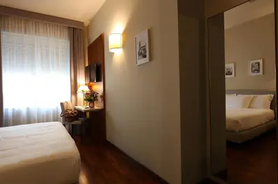 Letto o letti in una camera di Grande Albergo Maugeri