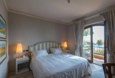 Letto o letti in una camera di Grand Hotel Baia Verde