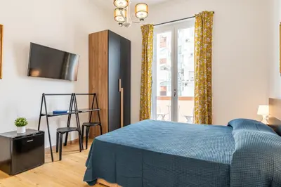 Letto o letti in una camera di Aurora Rooms