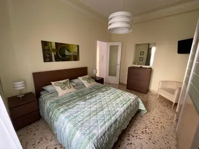 Letto o letti in una camera di Tra il nero e il blu - appartamento