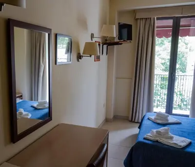 Letto o letti in una camera di Hotel Milomax