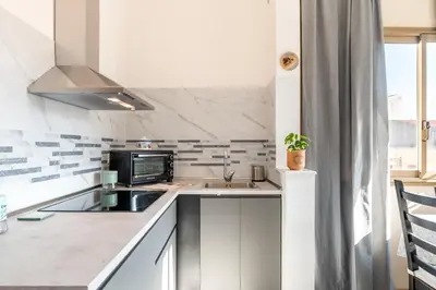 Cucina o angolo cottura di GuestHost - Parco Falcone Borsellino Cozy Apartment