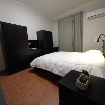 Letto o letti in una camera di Etna Home