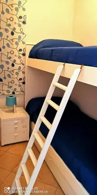 Letto o letti in una camera di Sea Garden, fronte mare con piscina
