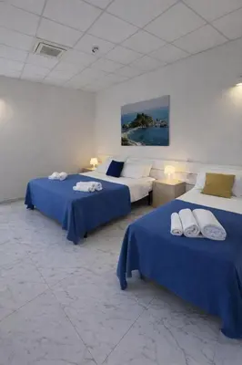 Letto o letti in una camera di ROOMS alCentro