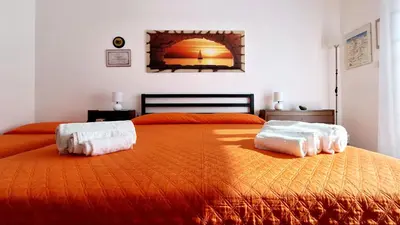 Letto o letti in una camera di Casa Iolanda