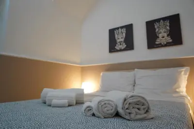Letto o letti in una camera di Sicily House Caronda Catania