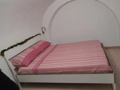 Letto o letti in una camera di Catania centro storico camere