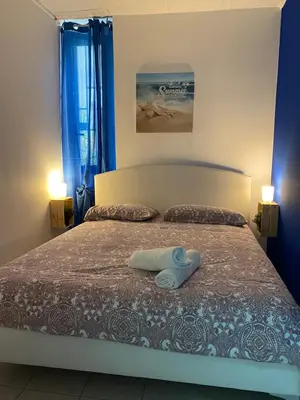 Letto o letti in una camera di PIRANDELLO HOME