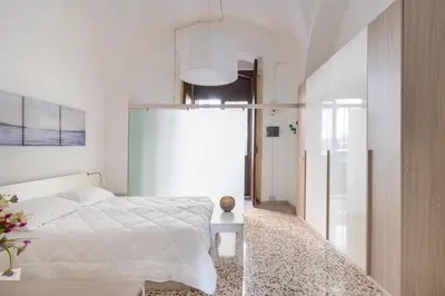 Letto o letti in una camera di GuestHost - Cilea Central Apt a few steps from the Station
