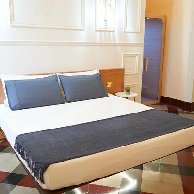 Letto o letti in una camera di Toscano Palace Luxury Rooms Catania