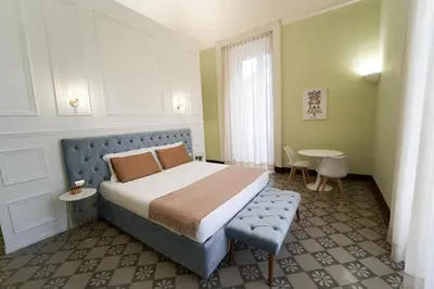 Letto o letti in una camera di Toscano Palace Luxury Rooms Catania
