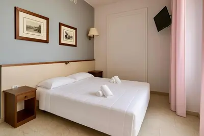 Letto o letti in una camera di Margherita Rooms