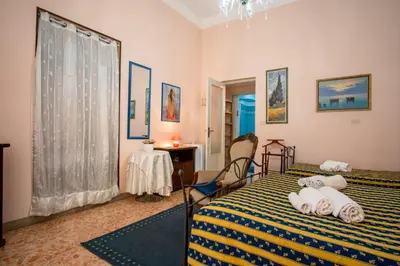 Letto o letti in una camera di Aci B&B