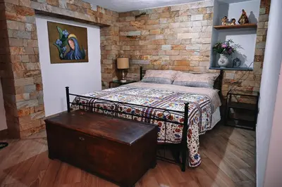Letto o letti in una camera di Casa Leopina Apri gli occhi e vola oltre il mare