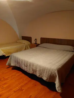 Letto o letti in una camera di Casa sotto l'Etna
