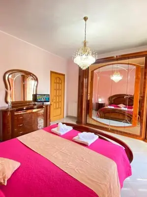 Letto o letti in una camera di CasaEtnaMarty Acireale